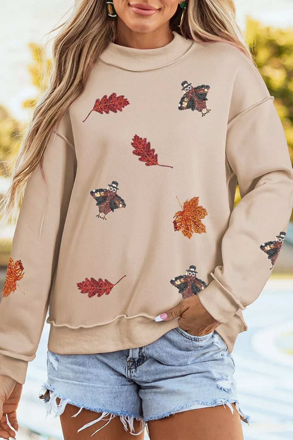 Sequin Turkey Leaf Graphic Exposed Seam Mock Neck Sweatshirt | STAHlin RADIANCE